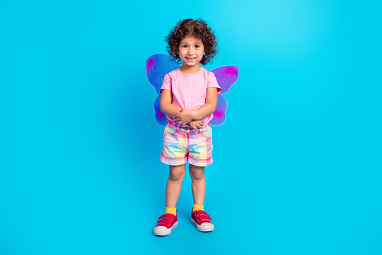 Full length body size view of pretty cheerful girl wearing costume isolated over bright blue color background
