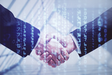 Double exposure of data theme hologram and handshake of two men. Partnership in IT industry concept.