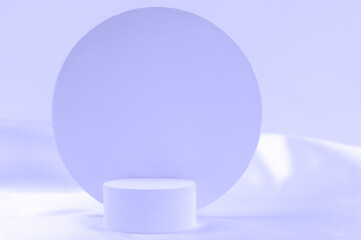 Empty podium on background in Very Peri color of the year with geometric shapes. Round podium for the presentation of cosmetic products.