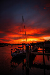 Fire over the Canal
We had an amazing sunrise in Lewes, Delaware.  I had to run out of the house and go shoot the canal, with the beautiful sunrise colors, with a sail boat/yacht in the foreground