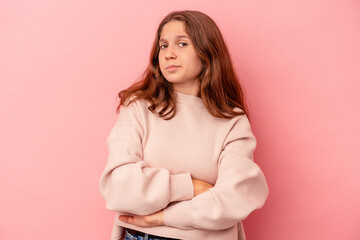 Obraz premium Little caucasian girl isolated on pink background unhappy looking in camera with sarcastic expression.