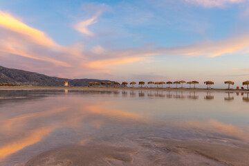 Fototapeta premium Stunning sunrise over the shallow waters of the Elafonisi lagoon (deer island) on the southwest tip of Crete, Chania region, Greece.