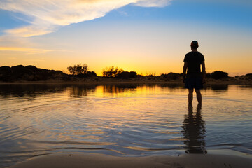 Fototapeta premium Stunning sunset over the shallow waters of the Elafonisi lagoon (deer island) on the southwest tip of Crete, Chania region, Greece.
