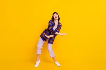 Keuken spatwand met foto Full length body size view of attractive cheerful girl dancing having fun chill out isolated over bright yellow color background © deagreez