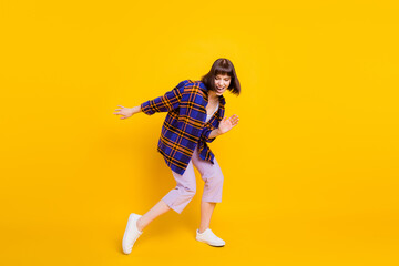 Fototapeta na wymiar Full length body size view of attractive cheerful funky girl dancing having fun rest chill isolated over bright yellow color background