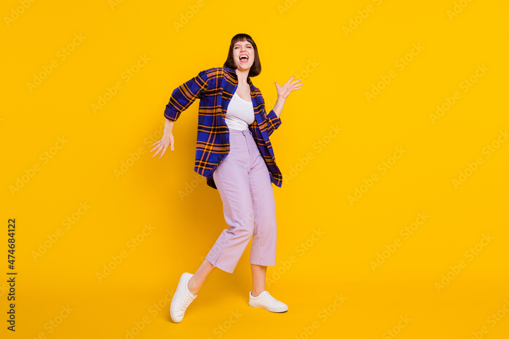 Sticker Full length body size view of pretty cheerful girl dancing having fun fooling singing song isolated over bright yellow color background