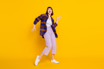 Fototapeta na wymiar Full length body size view of pretty cheerful girl dancing having fun fooling singing song isolated over bright yellow color background