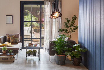 Modern decorative room with sofa and parquet floor, home design, wooden wall background and lamp concept, garden view.