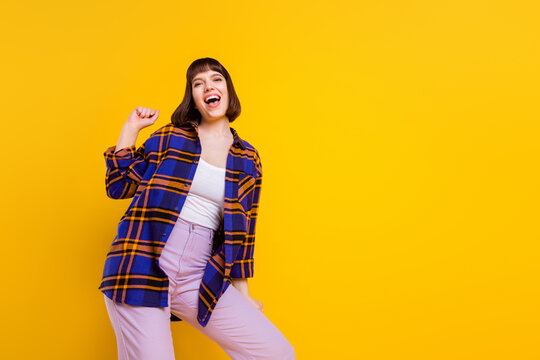 Portrait Of Attractive Cheerful Girl Rest Chill Out Good Mood Having Fun Copy Space Isolated Over Bright Yellow Color Background