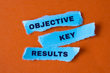 Text sign showing "Objective" , "Key" and "Results"