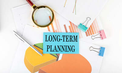 LONG-TERM PLANNING text on the sticker on the paper diagram