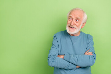 Photo of funny old beard man crossed palms look promo wear blue pullover isolated on green color...