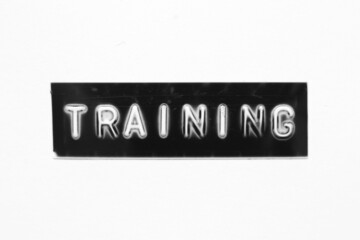 Black color banner that have embossed letter with word training on white paper background