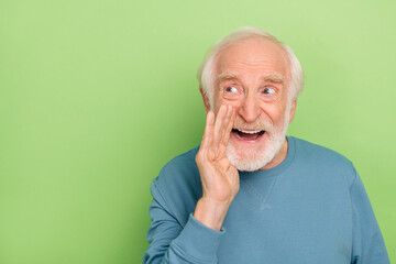 Photo of hooray old beard man say wear blue sweater isolated on green color background