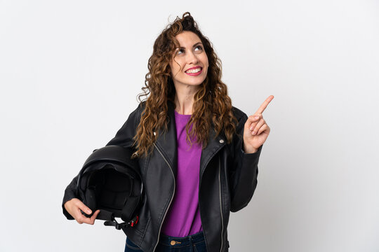 Young caucasian woman holding a motorcycle helmet pointing up a great idea