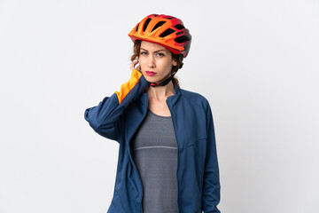Young cyclist woman isolated on white background having doubts