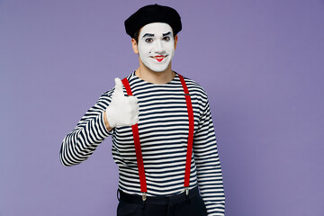 Smiling blithesome charismatic vivid young mime man with white face mask wear striped shirt beret...