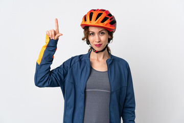 Young cyclist woman isolated on white background pointing up a great idea