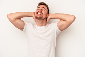 Fototapeta na wymiar Young caucasian man isolated on white background laughing happy, carefree, natural emotion.