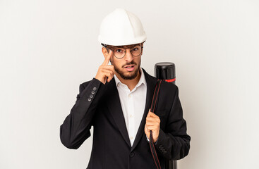 Young mixed race architect man wearing a helmet isolated on grey background showing a disappointment gesture with forefinger.