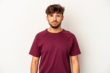 Obraz premium Young mixed race man isolated on grey background sad, serious face, feeling miserable and displeased.