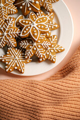 Ginger Christmas cookies on the on a delicate peach background.