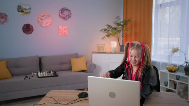 problems of addiction of children, a female parent quarrels with her daughter because of the girl's hobby for online games on a laptop at home
