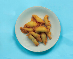 
Chocolate bananas from raw materials covered with rolls of pastry dough sheets. Molen bananas with pastries are usually served with a cup of hot coffee or tea. Focus blur