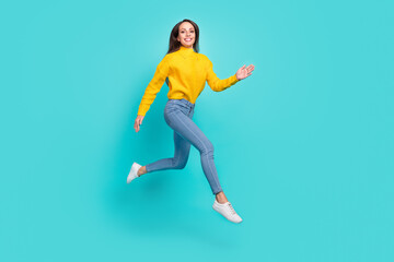 Fototapeta na wymiar Full length body size view of attractive cheerful thin girl jumping running isolated over vivid teal turquoise color background