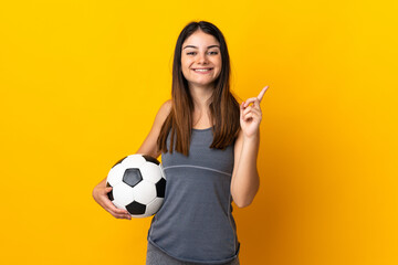 Young football player woman isolated on yellow background showing and lifting a finger in sign of the best