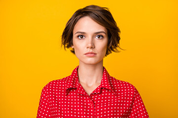 Photo of nice hairdo gorgeous young person look attentively camera isolated on yellow color background