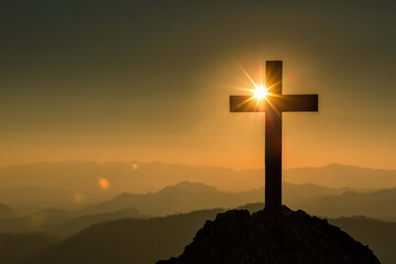 Christian cross on hill outdoors