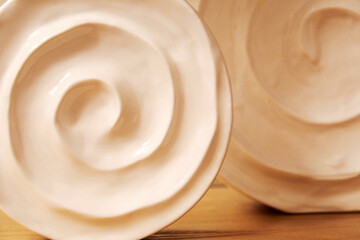 Decorative ceramic vases of a round shape on the table. Home interior backgrounds