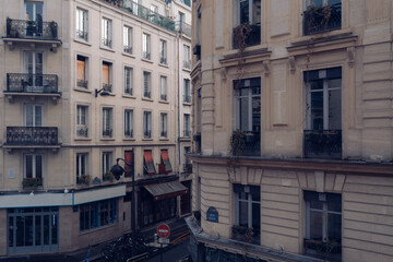 Fototapeta na wymiar Corner of vintage street in Paris with fancy apartment buildings on beautiful day
