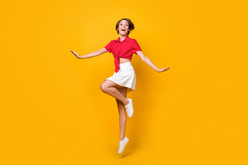 Fototapeta na wymiar Full size photo of excited cheerful lady have fun good mood look camera isolated on yellow color background