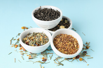 Concept of cooking tea with different types of tea on blue background