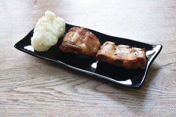 fried pork bone eat couple sticky rice on plate