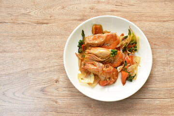 spicy stir fried river shrimp with fresh pepper and finger root on plate