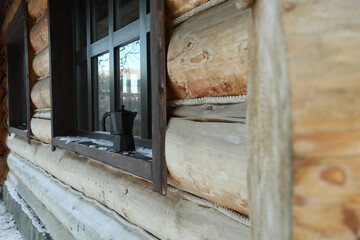 Fototapeta na wymiar Coffee maker outdoor on windowsill in winter day