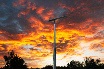 Solar cell street lamp pole on oranges  sky . background of  sunset
