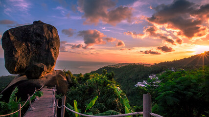 Background of evening natural light on high mountains overlooking the sea, coconut palms,hillside...
