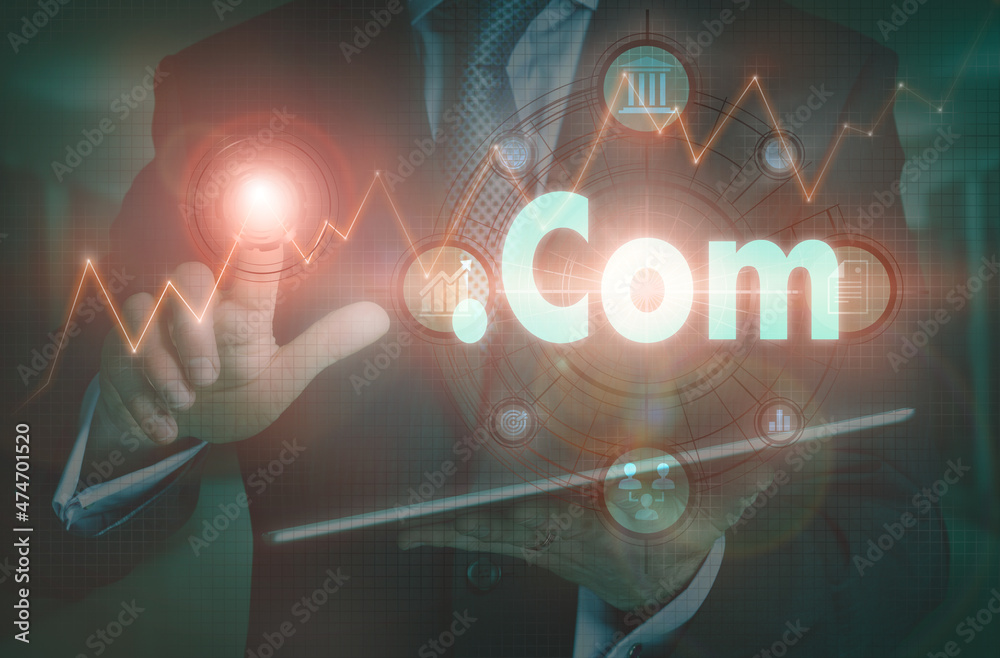 Wall mural a businessman operating a computer display with a dot com business word concept on it.