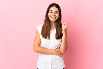 Young caucasian woman isolated on pink background laughing