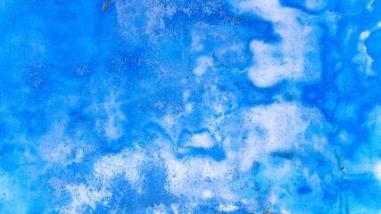 Wall flakes blue. Old rough stone on cement pattern wall background. Vintage grunge plaster or concrete stucco surface. Montage product design concept.