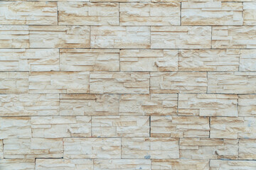 Beige background made of artificial stone