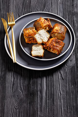 fried pieces of hake on a plate