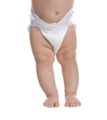 Cute baby in dry soft diaper standing on white background, closeup