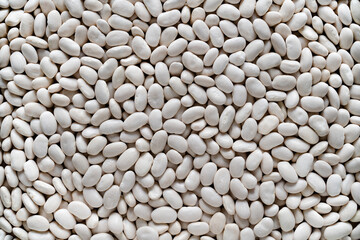 Textured background of white beans. Top view