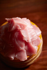 Tuna sashimi in a wooden bowl