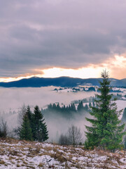 view of sunrise above snowed winter carpathian mountains